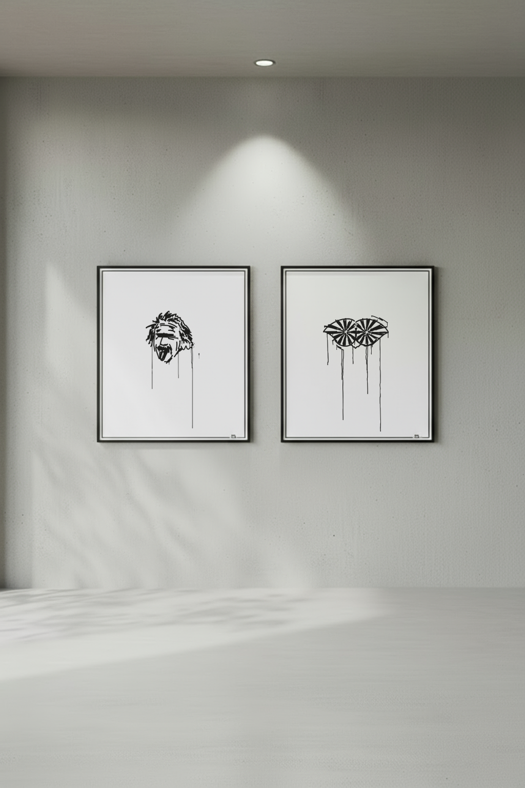 Zwei gerahmte Kunstdrucke im minimalistischen Urban-Art-Stil, darunter der Einstein und Albrecht Berblinger, der Schneider von Ulm Kunstdruck, frontal an grauer Betonwand präsentiert.