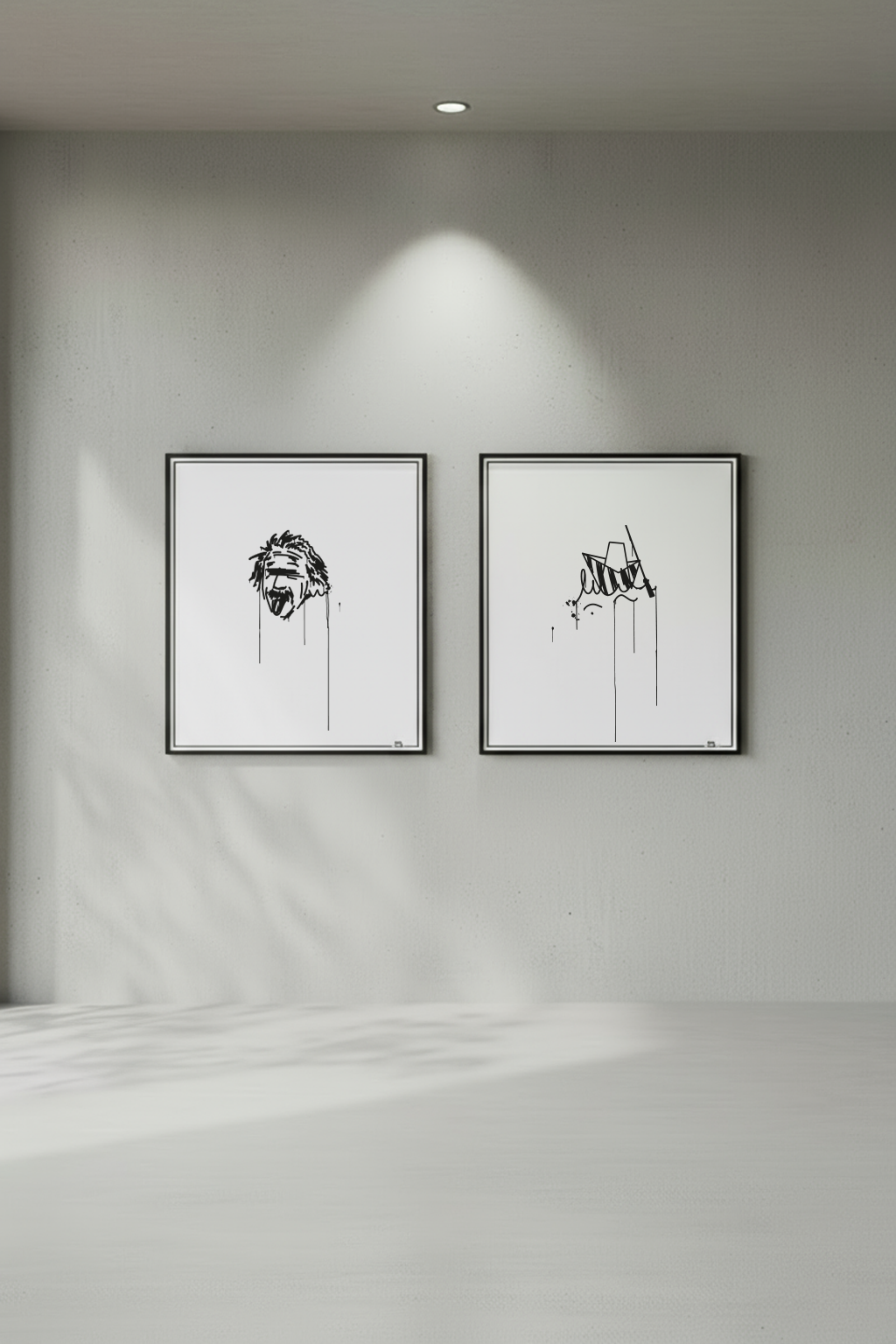 Zwei gerahmte Kunstdrucke im minimalistischen Urban-Art-Stil, darunter der Ulmer Schachtel Kunstdruck, frontal an grauer Betonwand präsentiert.